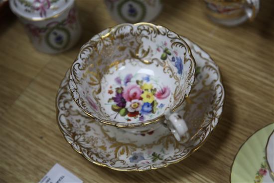 A collection of 19th century floral painted teaware and a French gilt decorated two handled vase